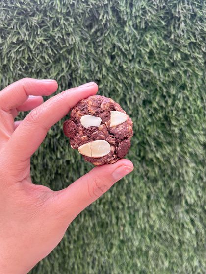 Our gluten-free Chocolate, Almond, and Oat cookie. It's a hearty, wholesome treat that's perfect for a quick energy boost.