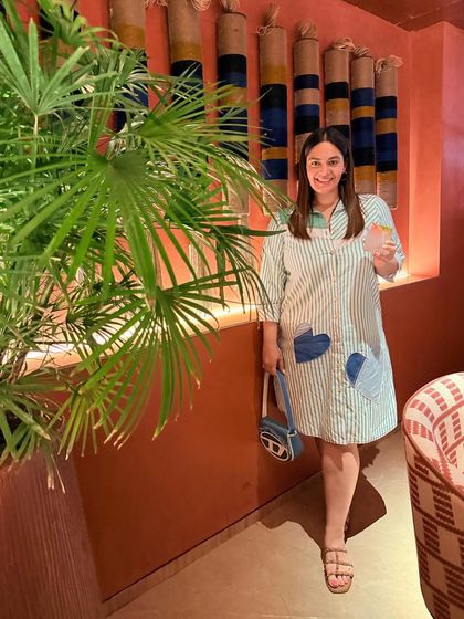 Sunday brunch at Mestizo Delhi. This photo combines my personal style with the restaurant's vibrant, Latin American inspired decor, creating a piece of lifestyle content.