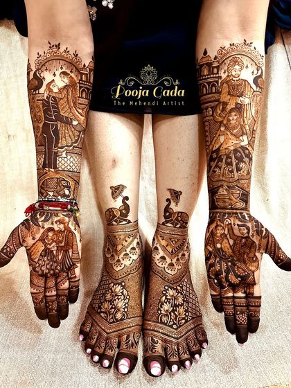 A complete heavy bridal look, with intricate dance and couple portraits on the hands and beautiful lotus and peacock designs on the feet.