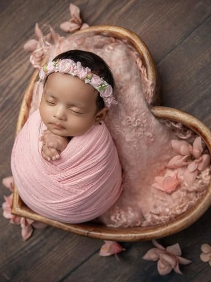 An overhead view of the pink heart bowl session, highlighting the beautiful contrast between the soft pink tones and the rustic wooden floor.