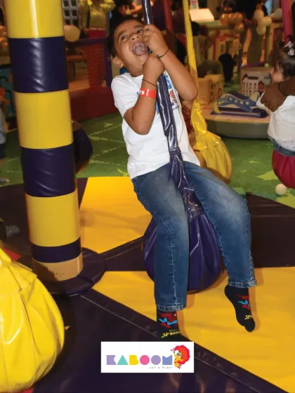 The thrill of swinging! This young adventurer is having the time of his life.