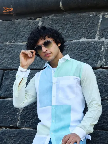The Zoop collection unveils a soft-colored linen shirt. This color-blocked piece is a gentle caress against the skin and a testament to understated luxury.