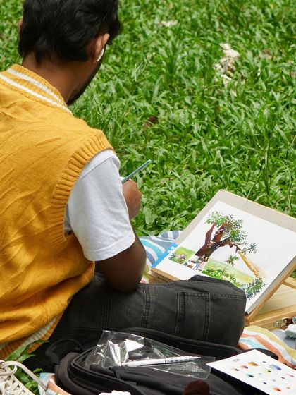 From behind, you can see me adding the finishing touches to a painting of a tree at Cubbon Park.