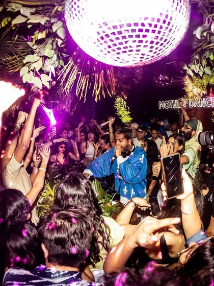 Under the disco ball at Mother Dance, where the magic happens. This shot perfectly captures the immersive, vibrant atmosphere we create, a space for everyone to feel free and connect.