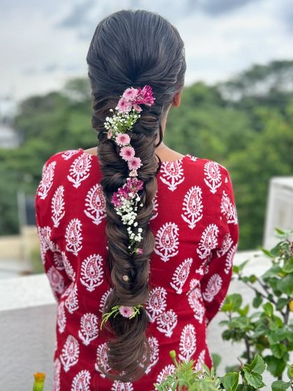 Another angle of the stunning floral fishtail braid, showing its texture and volume.