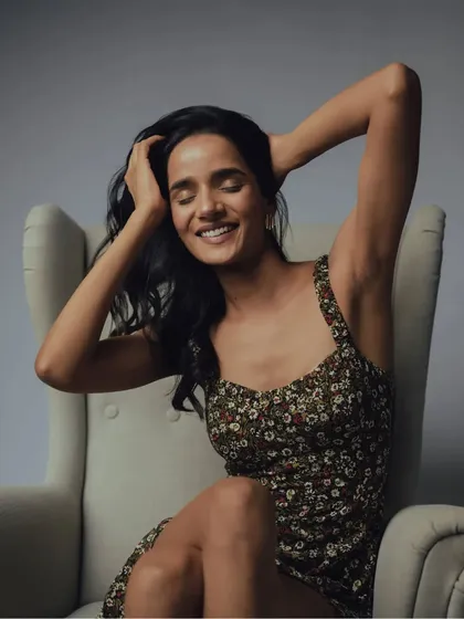 A happy, smiling shot that contrasts with the moodier photos. It shows the versatility of the model and the simple beauty of the makeup look.