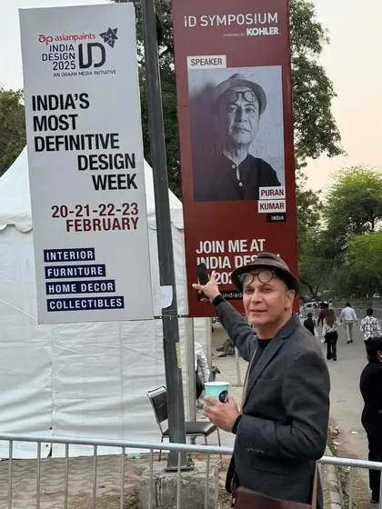 Puran Kumar pointing to his speaker banner at India Design ID 2025, one of the country's most definitive design weeks.