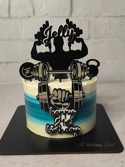 Celebrating a 21st birthday with some serious gains. This gym-themed cake is a fun way to celebrate a fitness milestone.