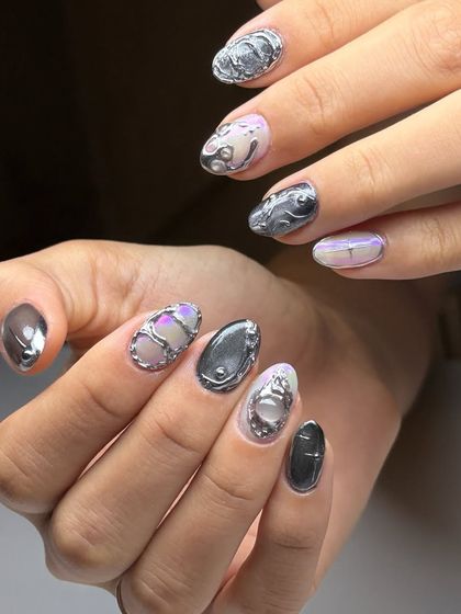 A final, comprehensive look at the masterpiece of 3D chrome nail art, a perfect example of the high-fashion, avant-garde designs we can create.