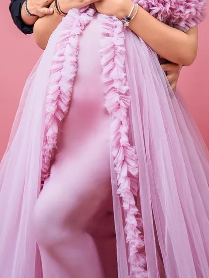 A close-up detail shot of our lavender Clara gown, showing the ruffled trail and the comfortable, form-fitting fabric of the dress.