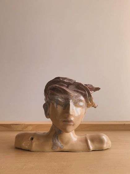 A finished bust by self taught artist Sudipto, who uses our kiln firing services. This piece showcases incredible detail and emotion, proving that passion and dedication are the most important tools for an artist.