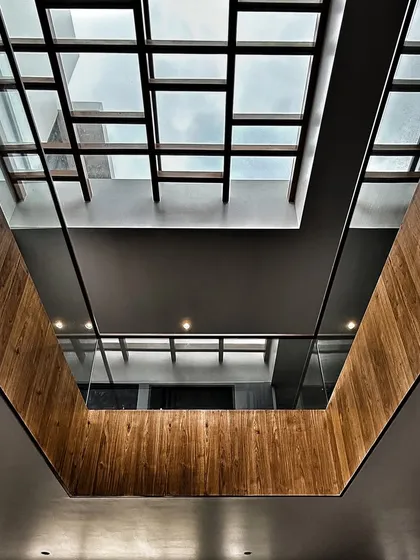 Looking up through a skylight in the 'Drishya' home. I design these openings to the sky not just for light, but to make you pause and notice the beauty in the everyday, connecting you with the world outside.