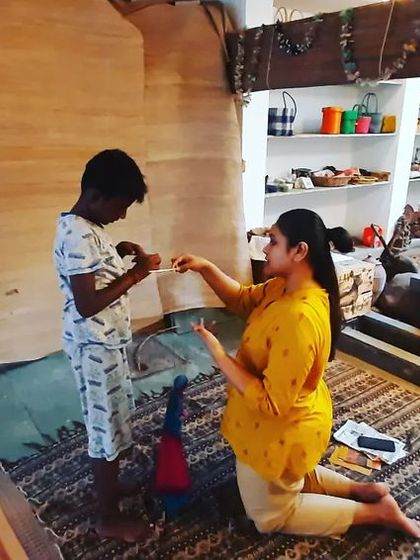 A child from the audience gets to interact directly with a puppet during our show at Tasmai Art Gallery. We love creating these participatory moments.