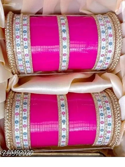 A classic pink bridal chooda (bangles) set with delicate white and gold detailing. This is an essential part of the North Indian bridal look, and I have them available.