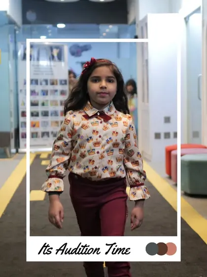 This participant looks sharp in a patterned shirt and bow tie, ready to impress the judges.