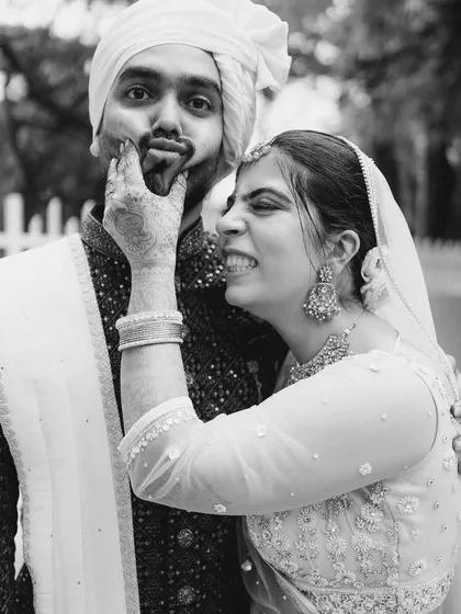 The playful, authentic connection between Karishma and Sumant shines through in this candid monochrome portrait. It’s a moment of pure fun and affection, a memory they will laugh about for years.