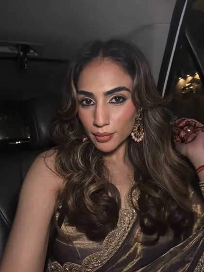 A car selfie after getting ready for a wedding. The soft glam makeup and wavy hair completed the festive look.