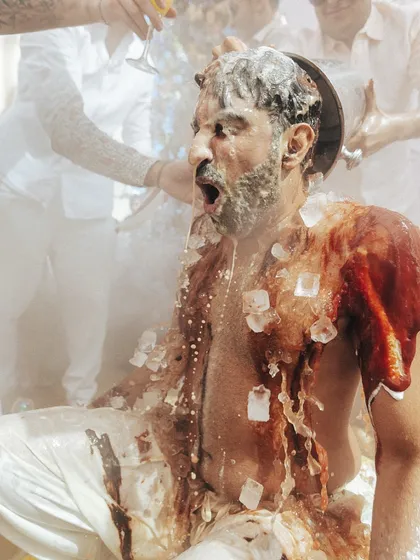 The pure, unadulterated joy of a Haldi ceremony. This moment, with ice and champagne, captures the wild, fun-loving spirit we love to bring to traditional rituals, making them uniquely yours.