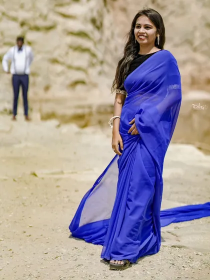A beautiful portrait of the bride in a simple yet elegant blue saree, taken at one of our outdoor quarry locations.