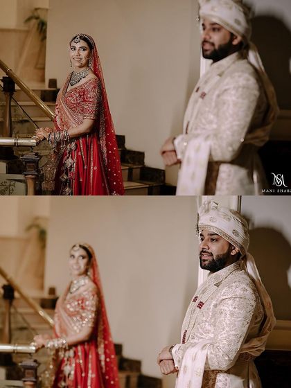 A "first look" style portrait on a grand staircase. The groom's happy expression as he sees his bride is a priceless, emotional moment to capture.