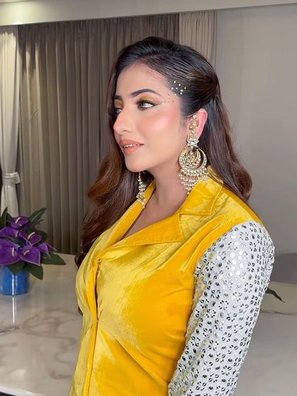 A little sparkle goes a long way. We styled these soft waves with a side part and added some delicate rhinestone clips for a touch of party-ready bling.