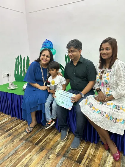 It's a family affair! A student, along with his proud parents and me, celebrating his successful performance and participation in our ocean-themed workshop.