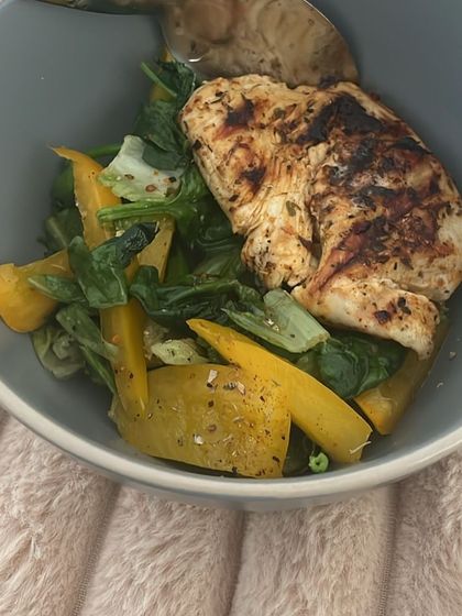 Another look at a client's anti-inflammatory meal: grilled chicken with spinach and yellow peppers. Consistency with meals like this leads to the best results.