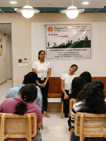 An instructor from my team demonstrates a gentle neck stretch during a corporate yoga session in Andheri, Mumbai. These simple movements are designed to release tension in the neck and shoulders, a common issue for desk workers.