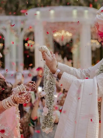 The Varmala exchange, surrounded by cheering friends and family.