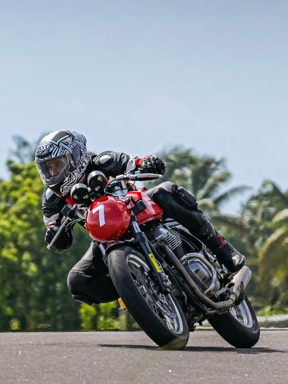 All eyes on the track. A rider focuses on the corner ahead during a session at the Royal Enfield Track School, a program we proudly power with our coaching expertise.