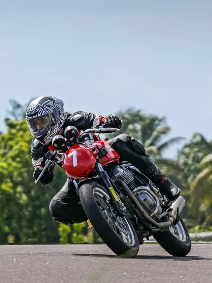 All eyes on the track. A rider focuses on the corner ahead during a session at the Royal Enfield Track School, a program we proudly power with our coaching expertise.