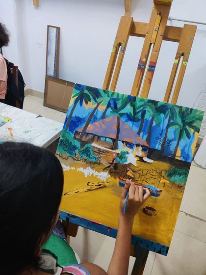 See how a student builds up a vibrant tropical beach scene, learning to paint palm trees, a hut, and the sandy shore.