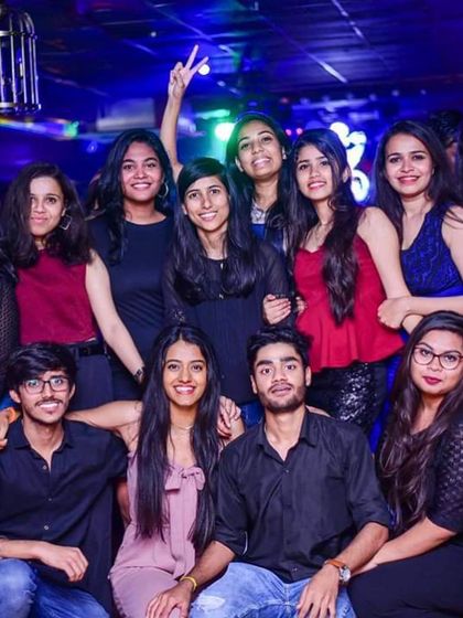 A large group of friends posing for a photo during my set. Creating nights where people can come together and make memories is what it's all about.