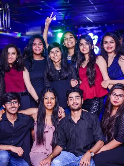 A large group of friends posing for a photo during my set. Creating nights where people can come together and make memories is what it's all about.