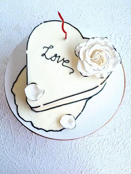 A top-down view of the heart-shaped comic cake.