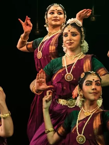 The beauty of Bharatanatyam is in the details. This is a shot of my senior dancers during a stage show, highlighting their synchronized movements, expressive faces, and the authentic temple jewellery and costumes we use for all our performances.