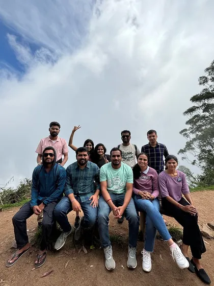 A group of friends relaxing at a viewpoint in Kodaikanal.