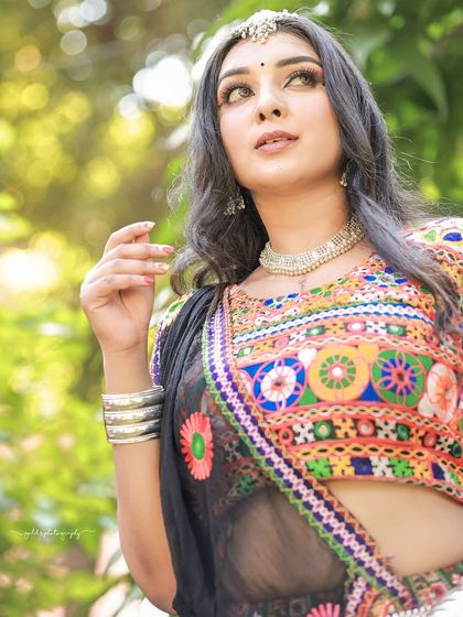 A vibrant and energetic series celebrating Navratri. The model is dressed in colorful Garba attire, and the photos capture the festive spirit through dynamic poses and joyful expressions.