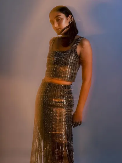 A motion-blur shot that captures the ethereal quality of the wet-look hair and glowing skin. This technique is often used in editorials to create a sense of movement and dreaminess.
