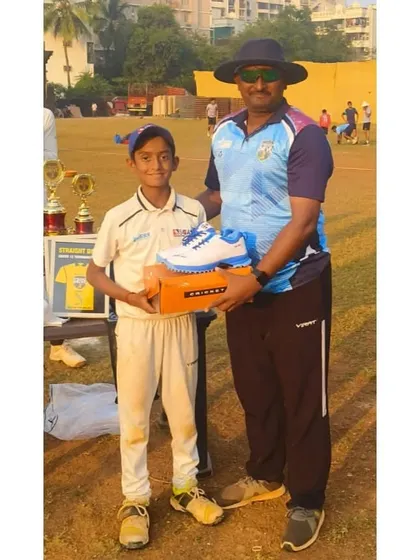 Ayush Dubey receiving the Best Bowler of the tournament award from our head coach for his outstanding performance.