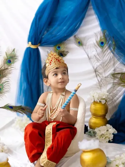 This little lord is looking right at the camera, ready for his close-up. The Janmashtami sessions are always filled with so much love and devotion.