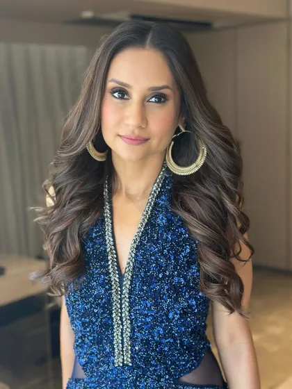 A beautiful portrait capturing the joy of the celebration. The makeup is designed to look flawless in photos, ensuring she has beautiful memories of this special milestone.
