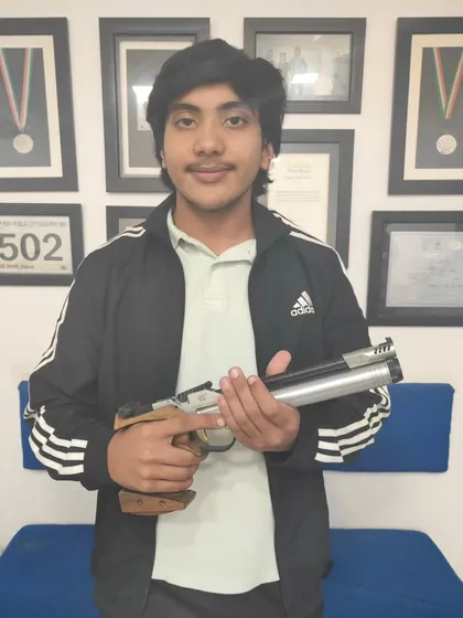 Anirudh proudly holds his pistol after qualifying for the National Championship at the India Open in Bhopal. A fantastic achievement for a dedicated shooter.