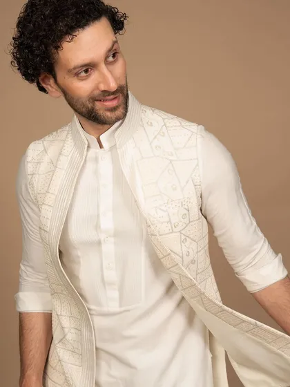 A closer view of the geometric white Nehru jacket, highlighting the precision of the embroidery. It's a testament to my belief that true style is found in the thoughtful details.