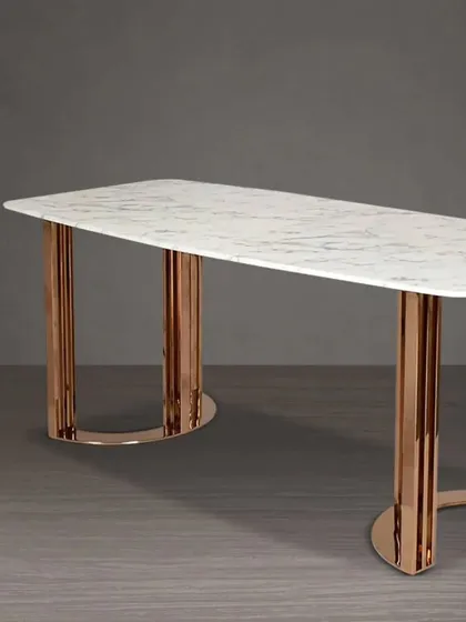 A variation of our dining table with a white marble top and a cylindrical rose gold base for a bold, modern statement.