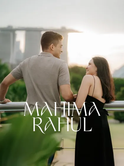 A couple enjoying the view of the Singapore skyline at dusk. This candid shot captures a quiet, shared moment during their destination pre-wedding photoshoot.