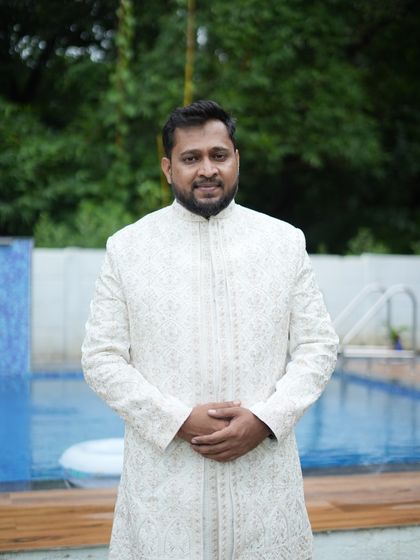This off-white embroidered sherwani is a subtle yet very elegant choice for a groom or a close family member. It is available for rent and looks great in photos.
