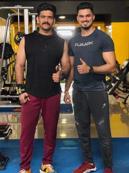A thumbs up with Roopesh Shetty after a solid workout session. The positive energy and commitment from clients like him make the gym a motivating place for everyone.