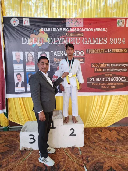 My student Oblesh receiving his silver medal at the Delhi Olympic Games 2024.
