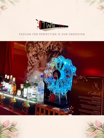 A unique bar setup featuring a glowing Ferris wheel for shots, adding a playful and dynamic element to the Sangeet night at ITC Maratha.